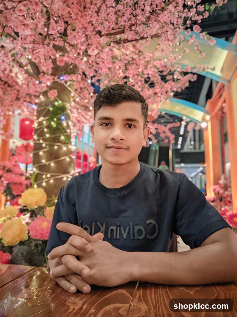 Man sitting at a table with cherry blossoms