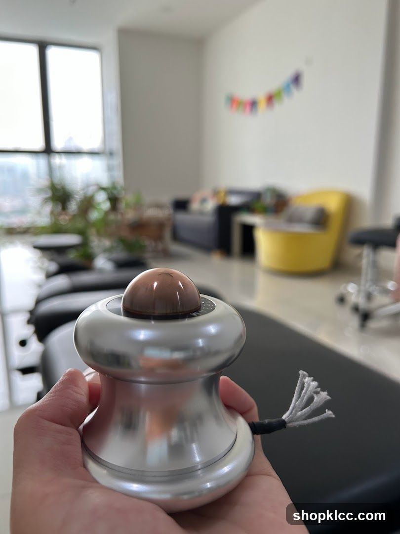 Hand holding a massage device