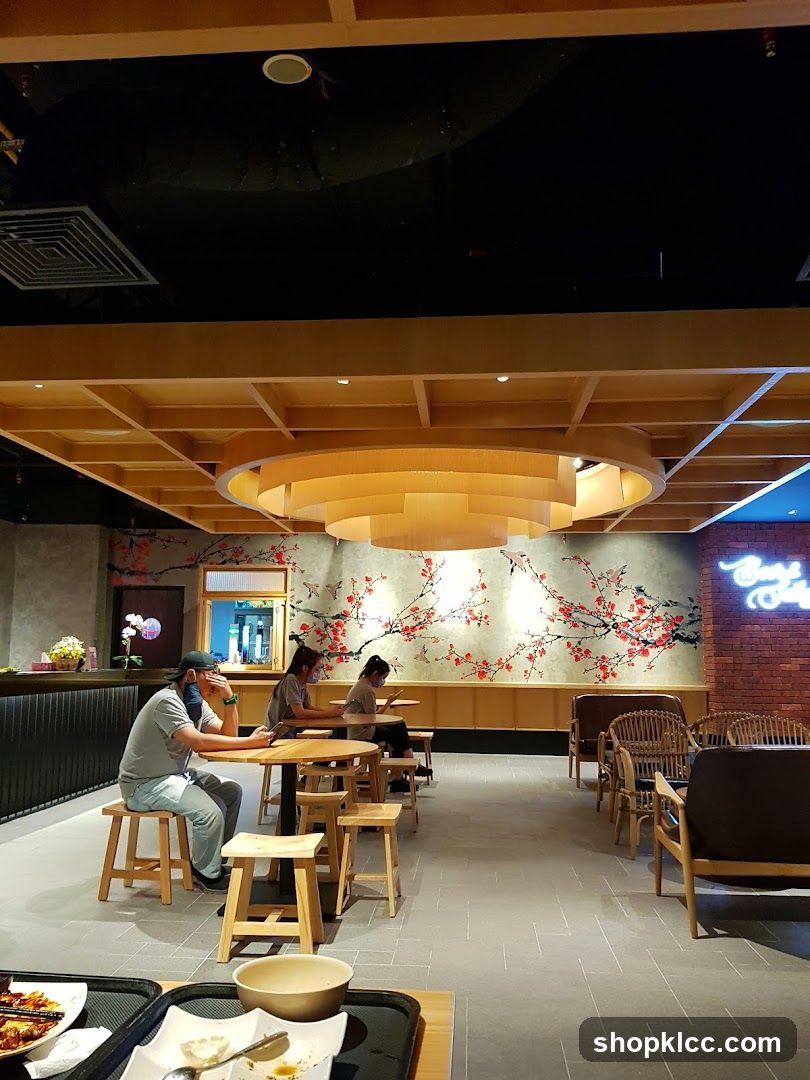 Interior of a restaurant with cherry blossom mural