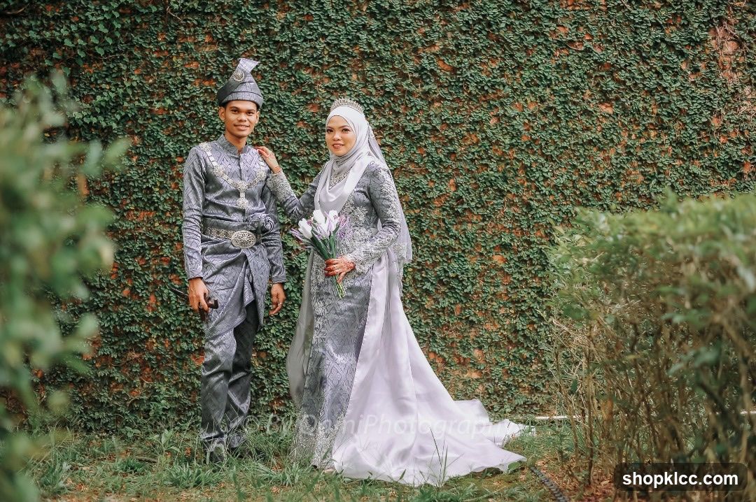 Wedding Couple Posing in Traditional Attire