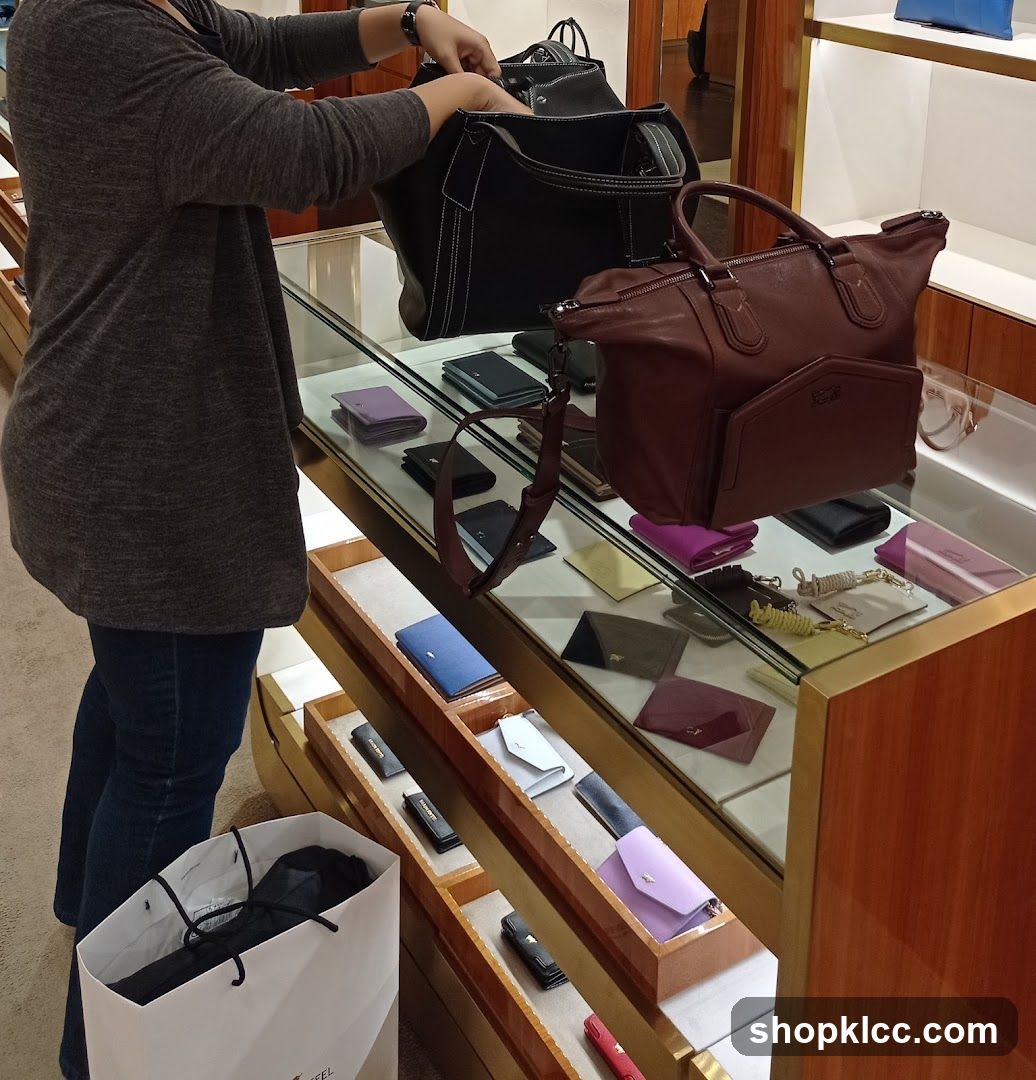Woman browsing handbags and wallets in a store