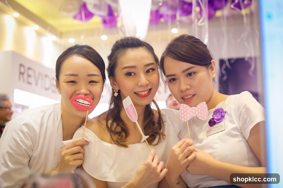 Three Women Posing with Props