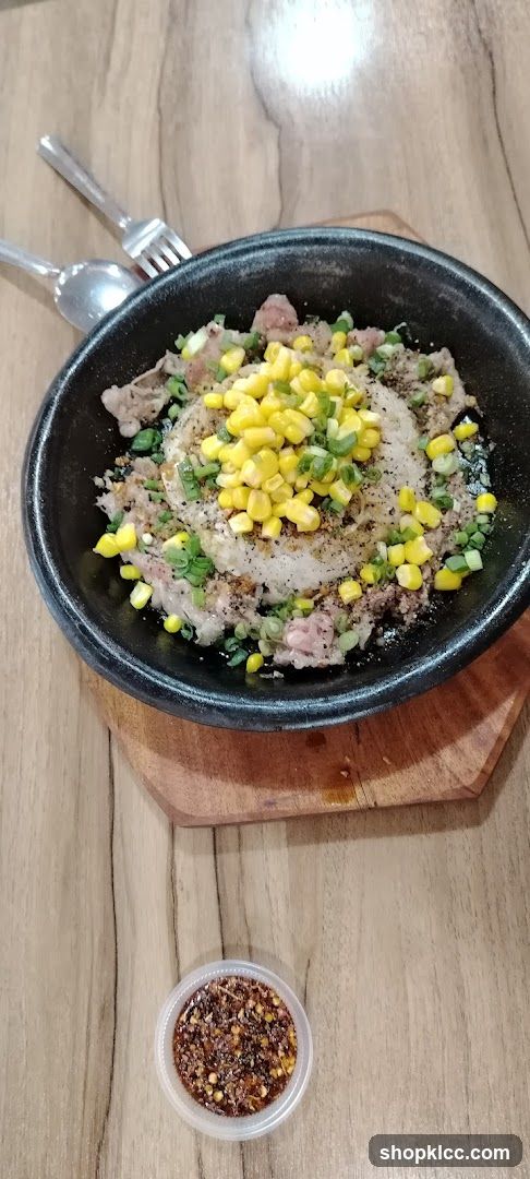 Sizzling Rice Dish with Corn and Meat