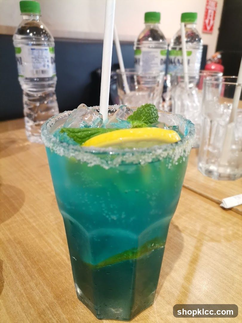 Blue Cocktail with Mint and Lemon