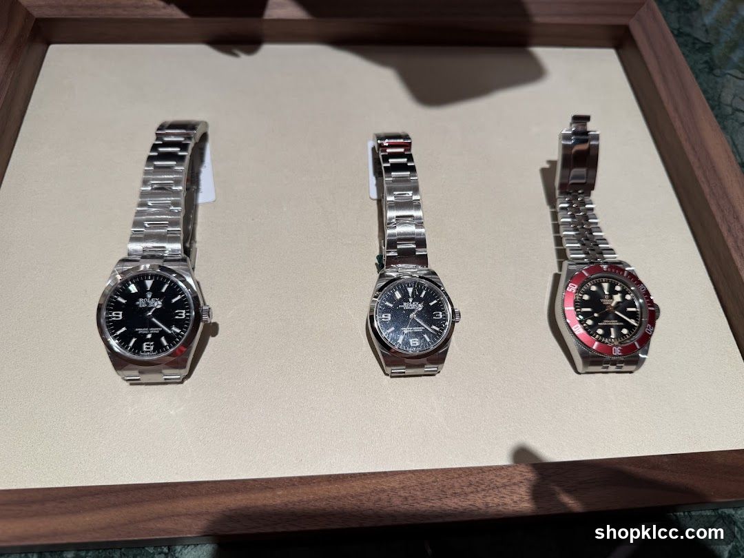 Three luxury watches on display