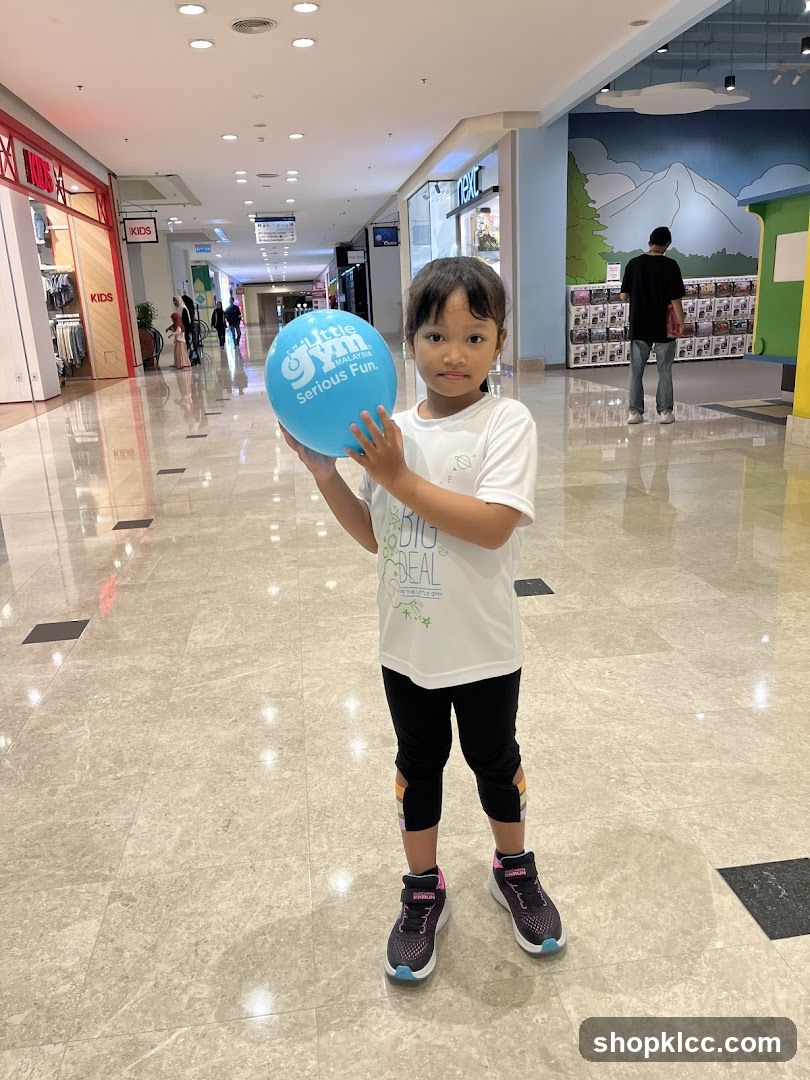 Girl Holding a Blue Balloon