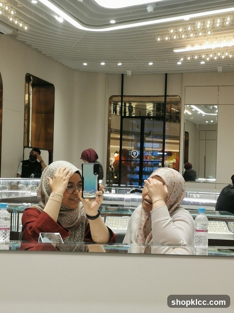 Two women taking a selfie in a jewelry store