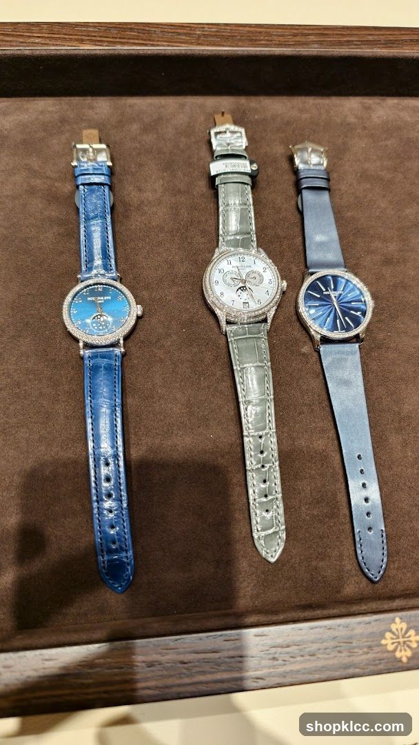 Three luxury watches on display