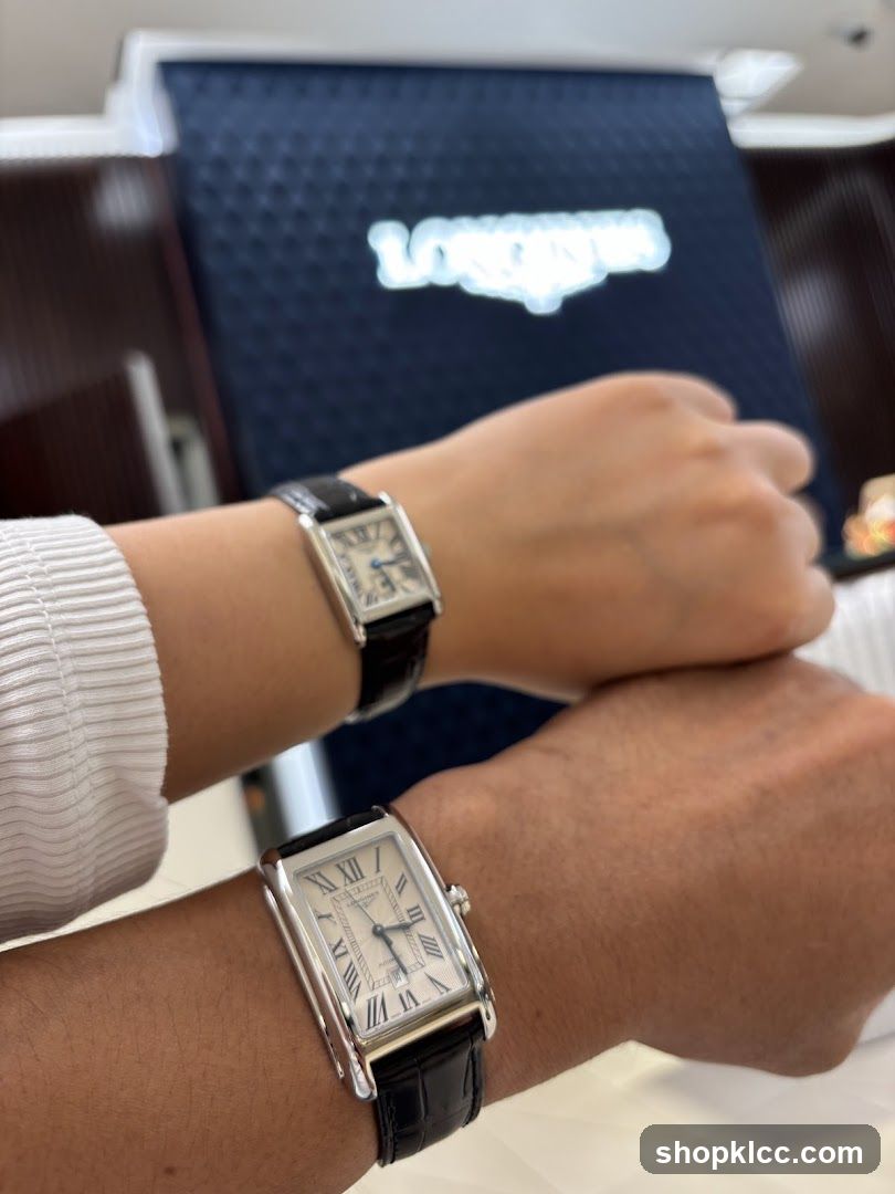 Two watches on wrists