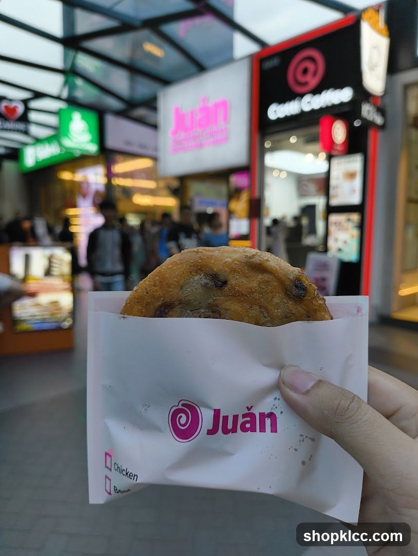 Pastry in a wrapper with shop logo