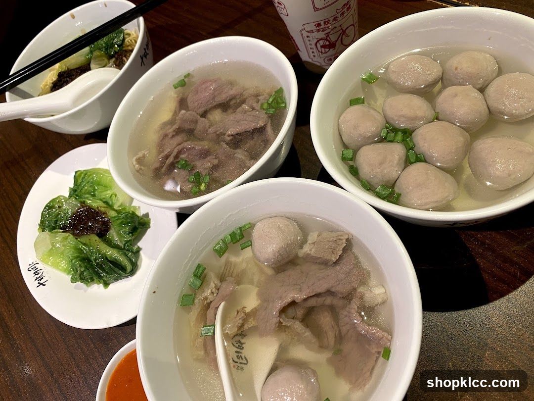 Bowls of Noodle Soup and Side Dishes