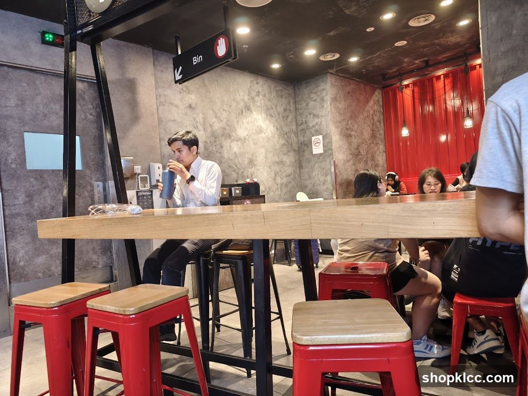 People sitting at a counter in a cafe