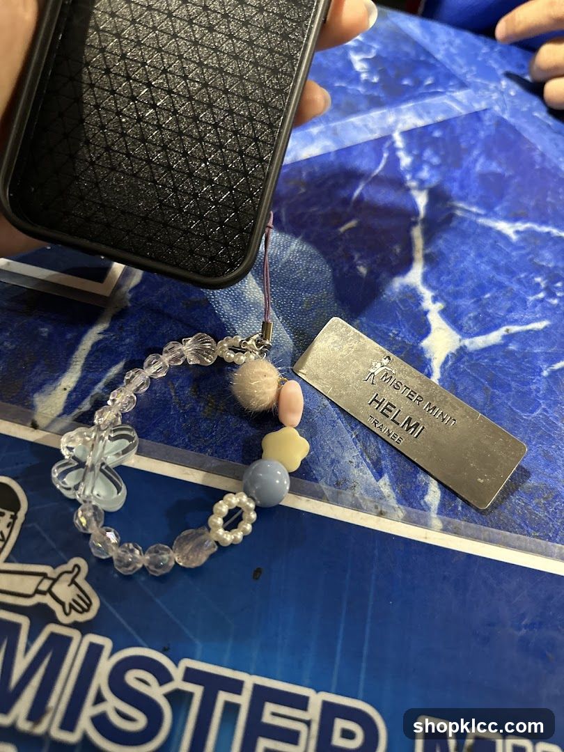 Phone with charm and name tag
