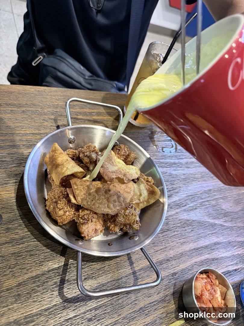 Pouring Sauce on Fried Food