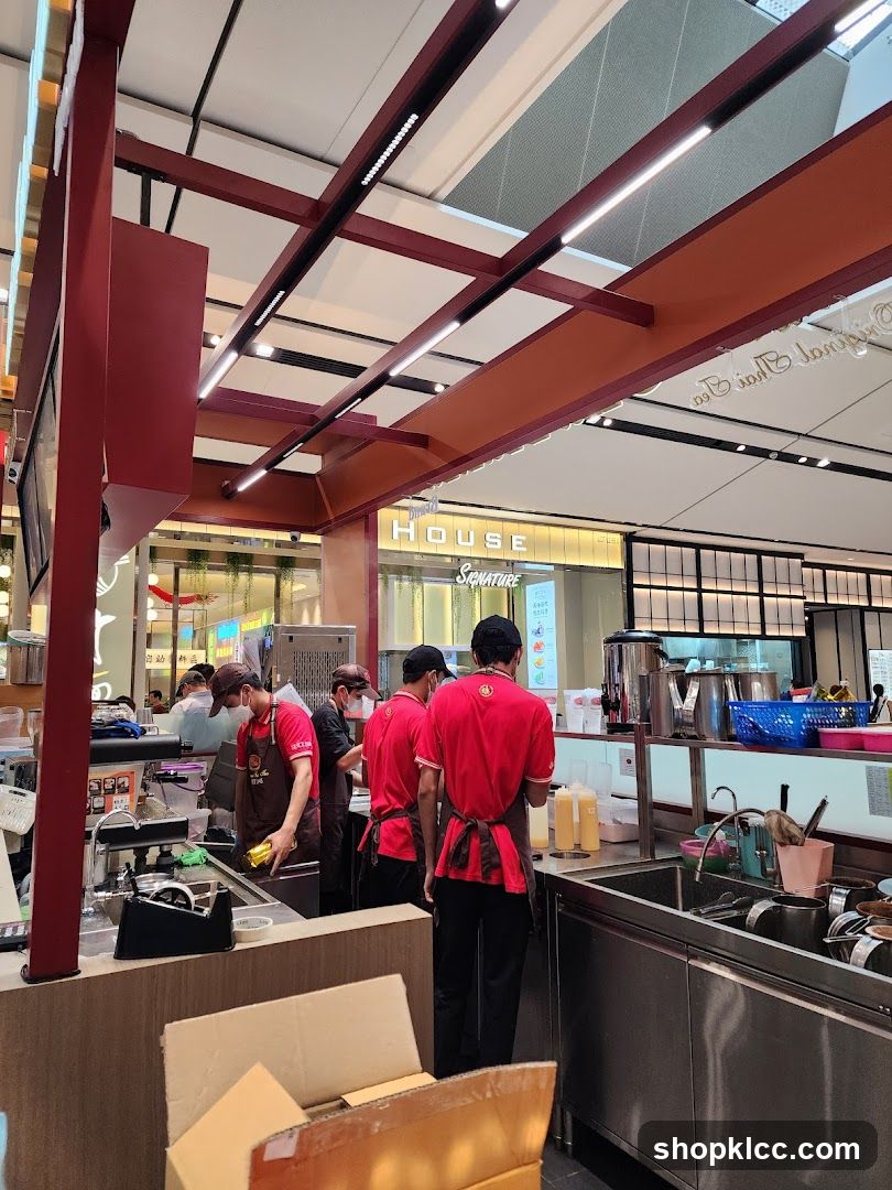 Beverage Shop Staff Preparing Drinks
