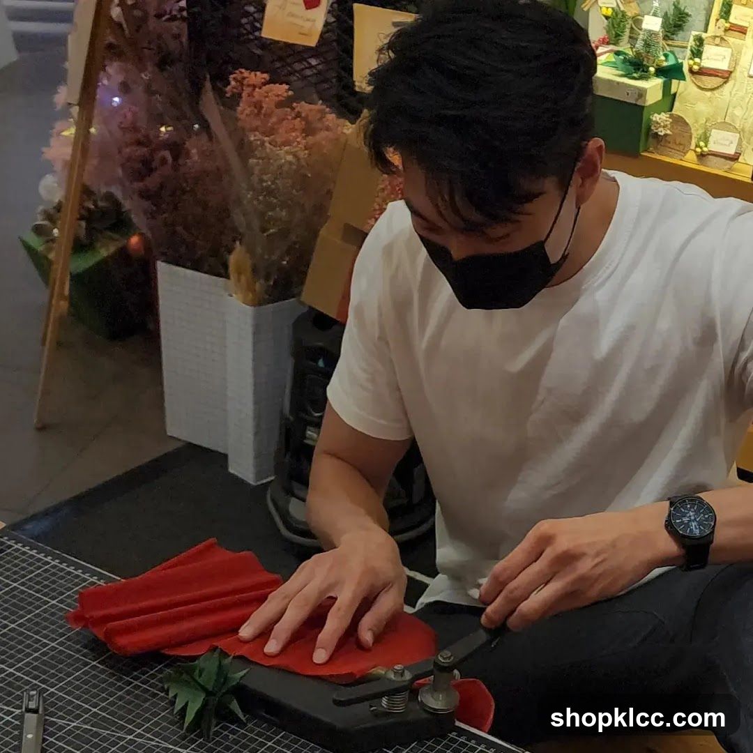 Man crafting with red fabric