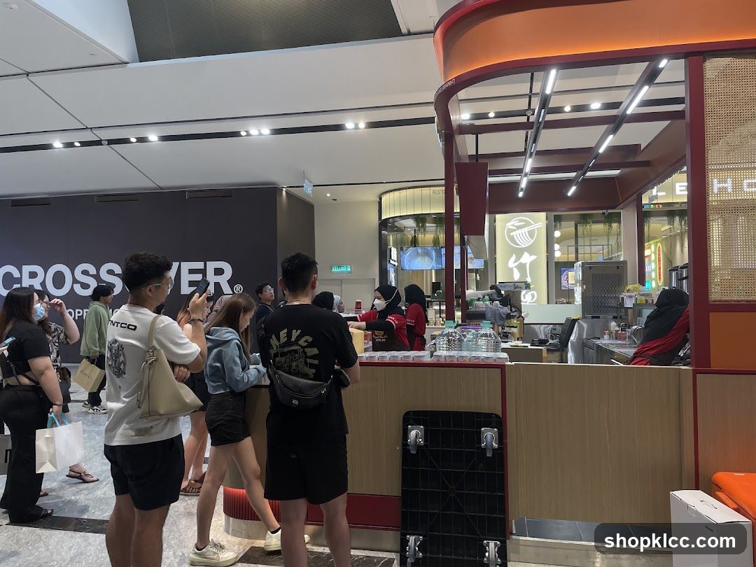 People queuing at a food stall