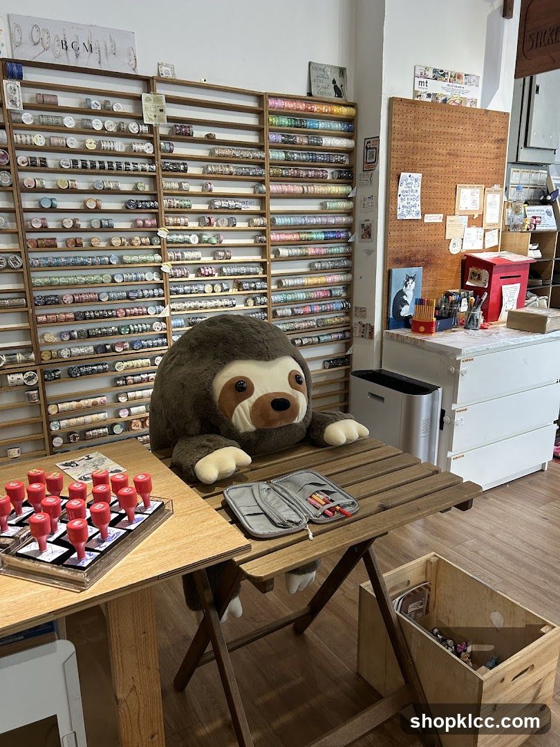 Sticker shop interior with sloth plush