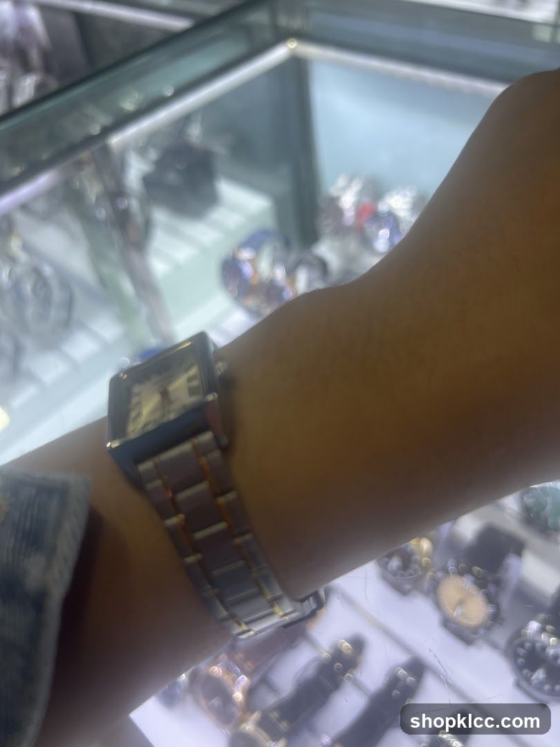 Watch on wrist in display case