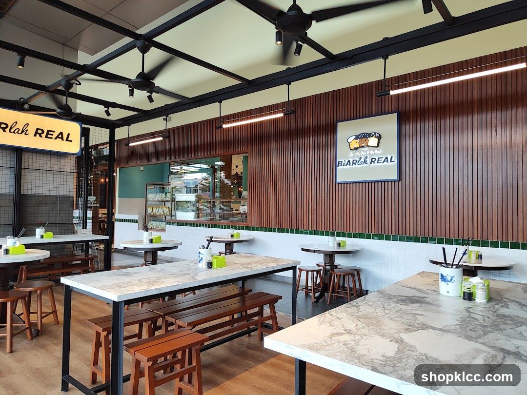 Interior of a cafe with wooden accents and marble-patterned tables