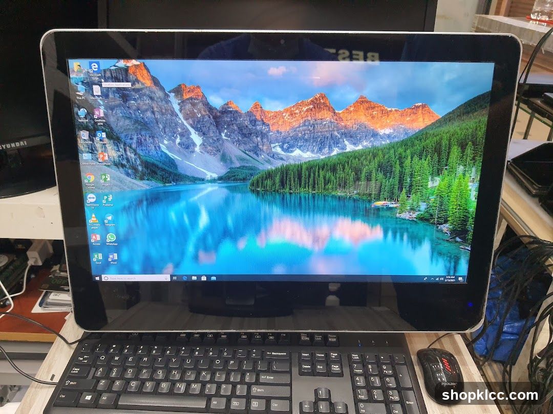 All-in-one computer with a mountain lake wallpaper