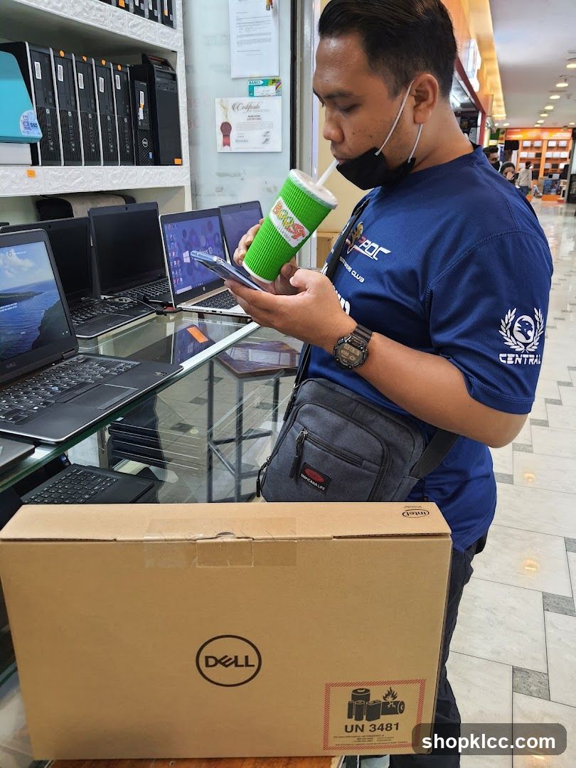 Man with Dell Laptop Box and Drink