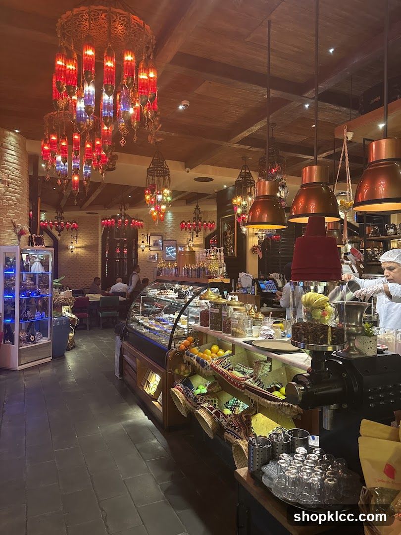 Interior of a cafe with ornate lighting and display cases