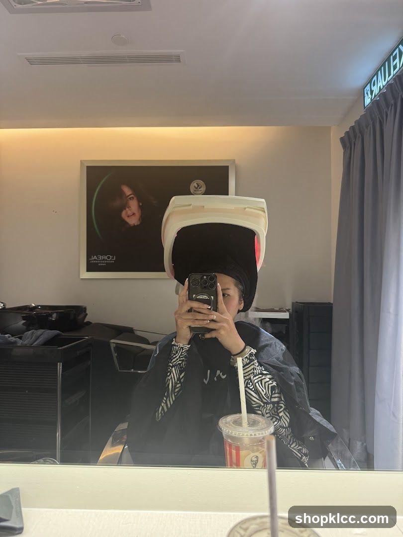 Woman under hair dryer