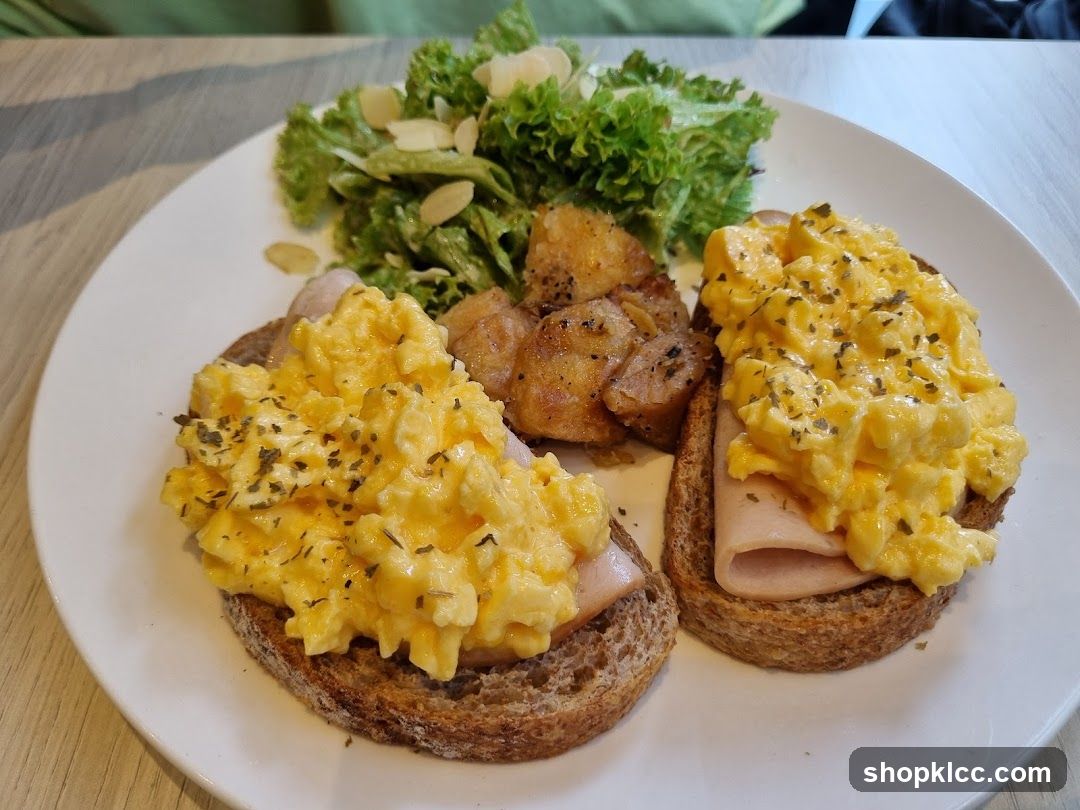 Scrambled Eggs on Toast with Side Salad and Potatoes