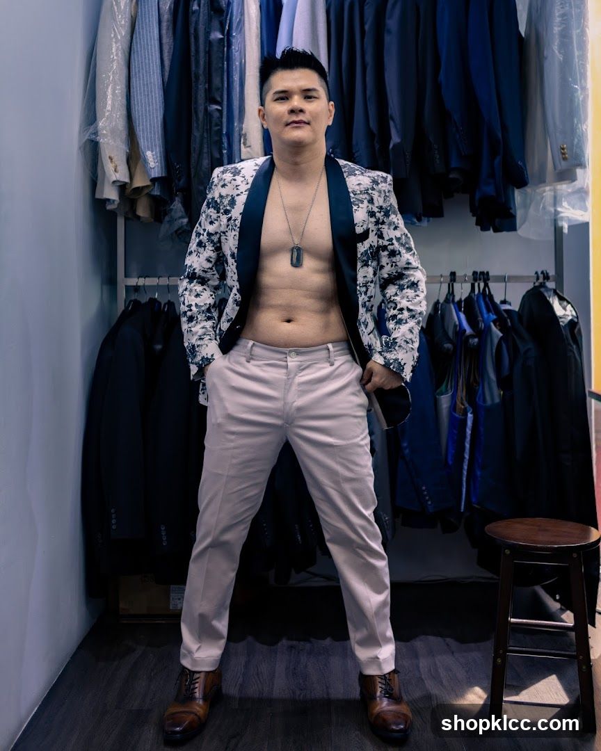 Man in a patterned jacket and light pants