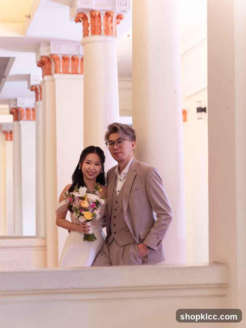 Wedding Couple Posing by Columns
