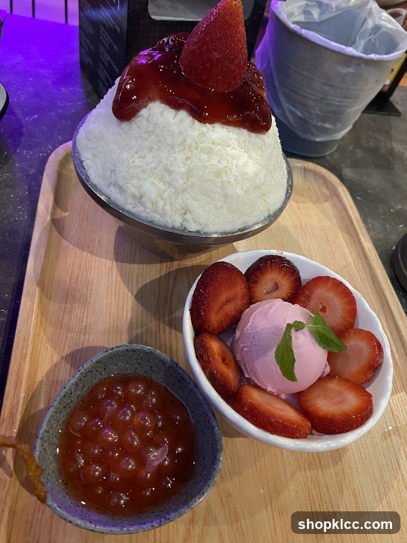 Strawberry shaved ice with ice cream and boba