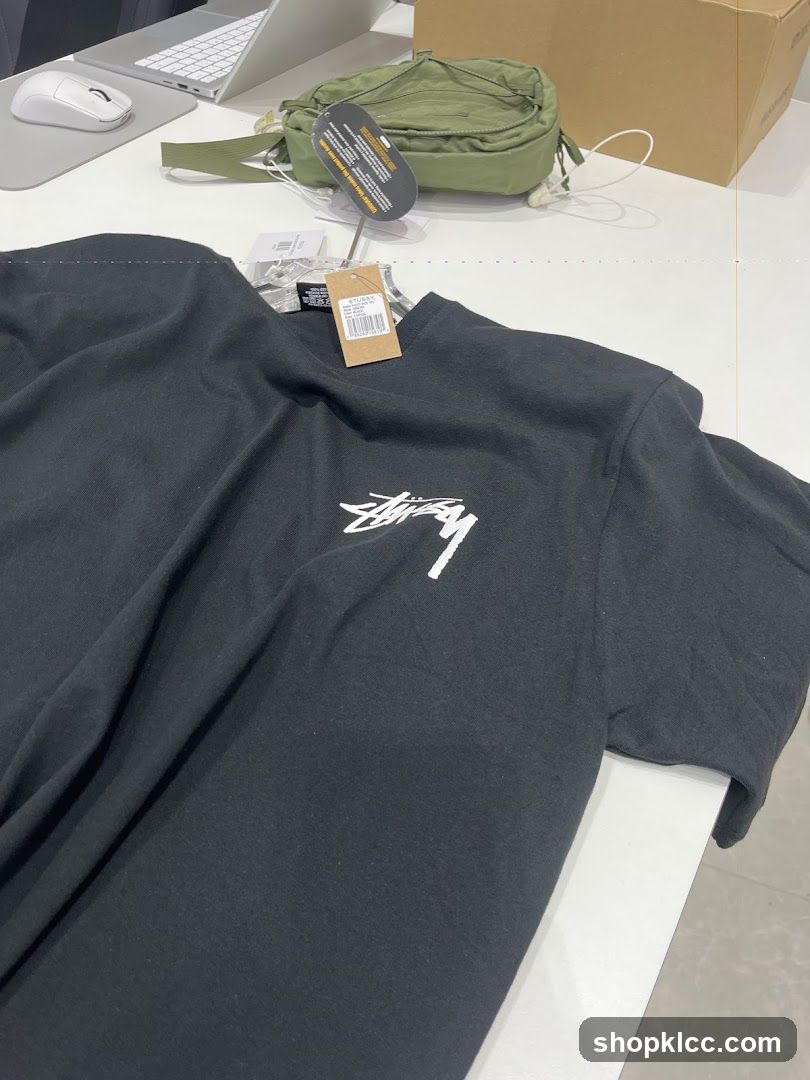 Black T-shirt with Stussy logo