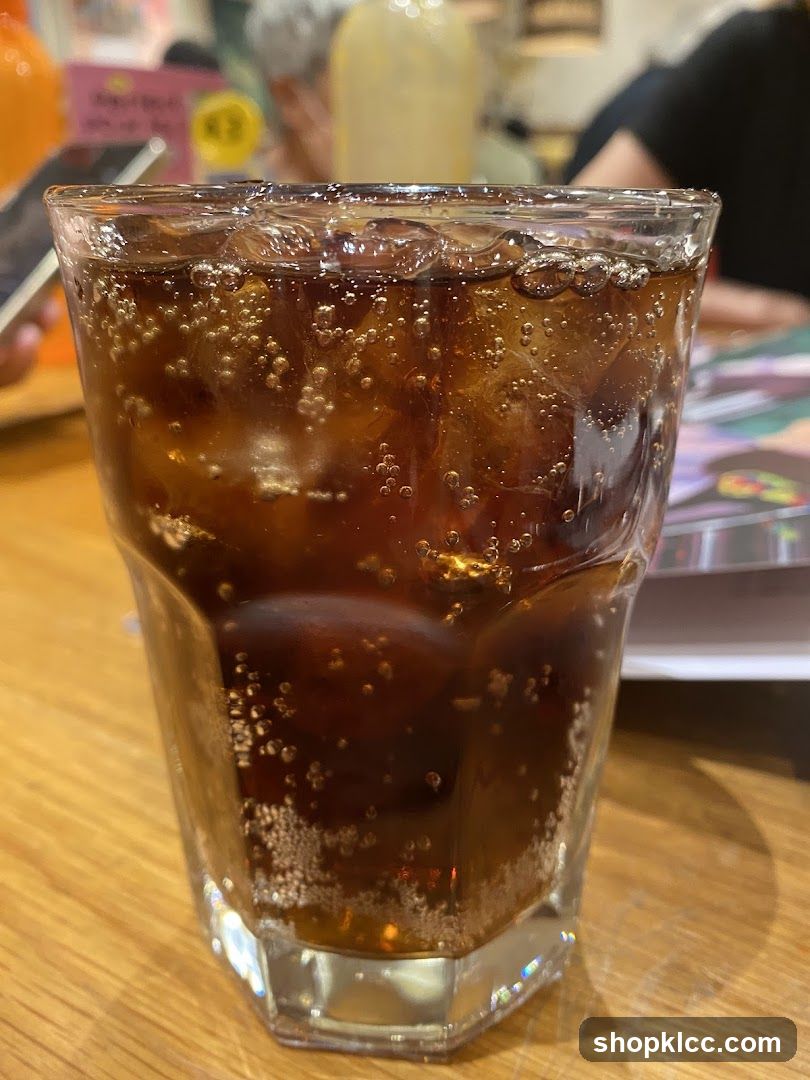 Glass of cola with ice