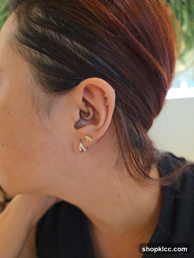 Woman with multiple ear piercings