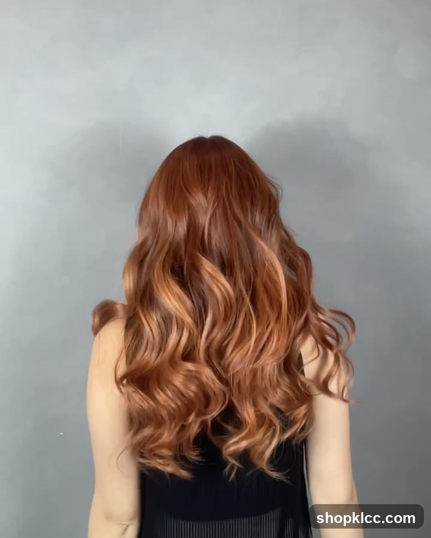 Woman with long, wavy, copper-toned hair