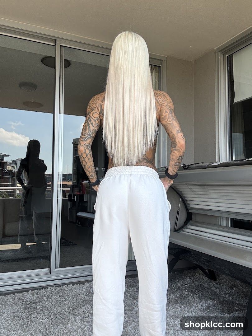 Woman in white sweatpants and blonde hair