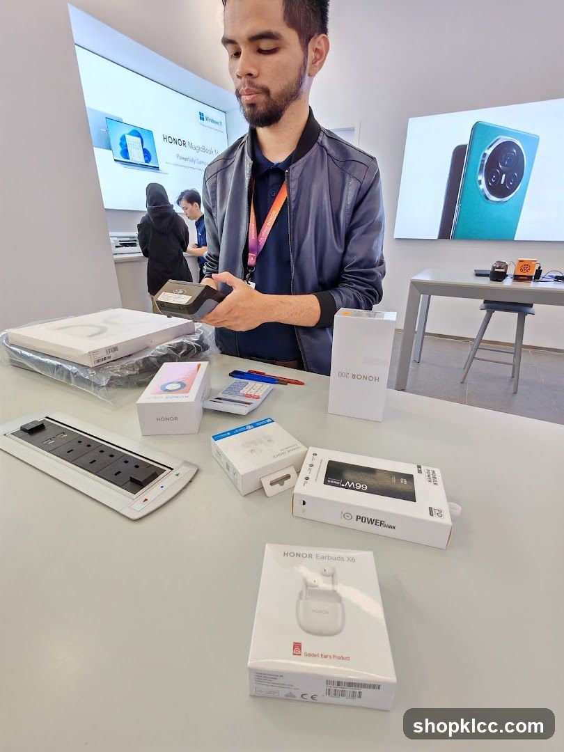 Man holding electronics in a store