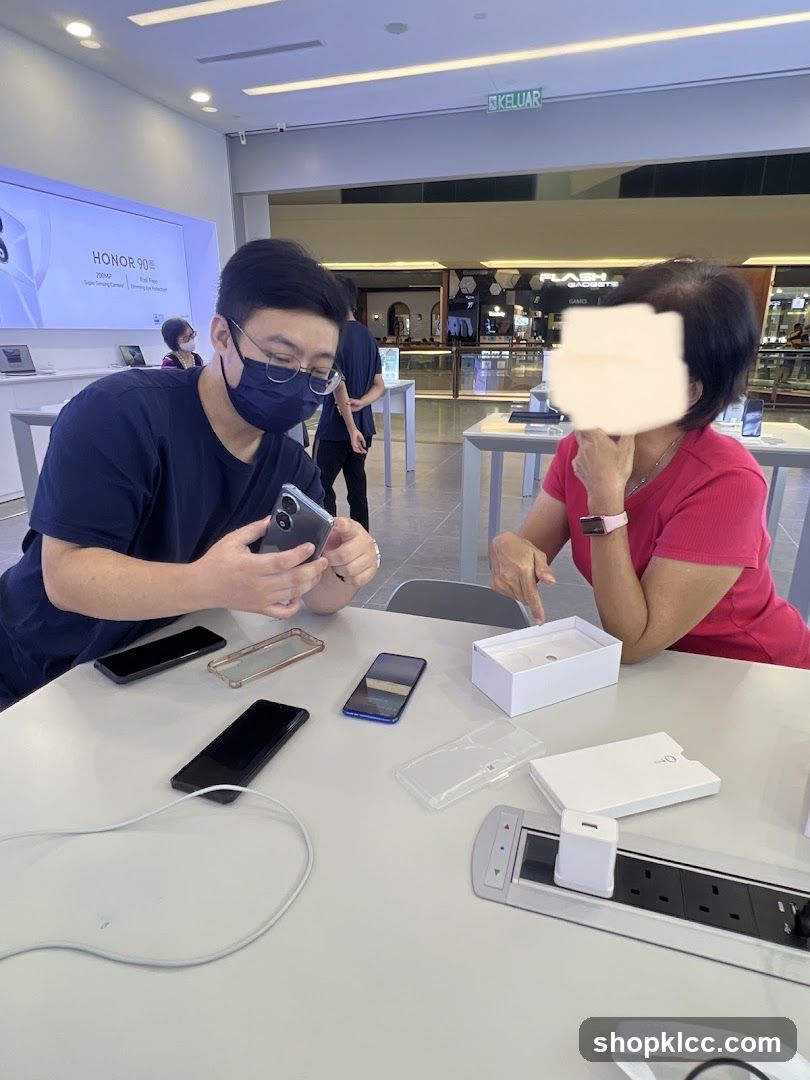 Customers examining phones in a store