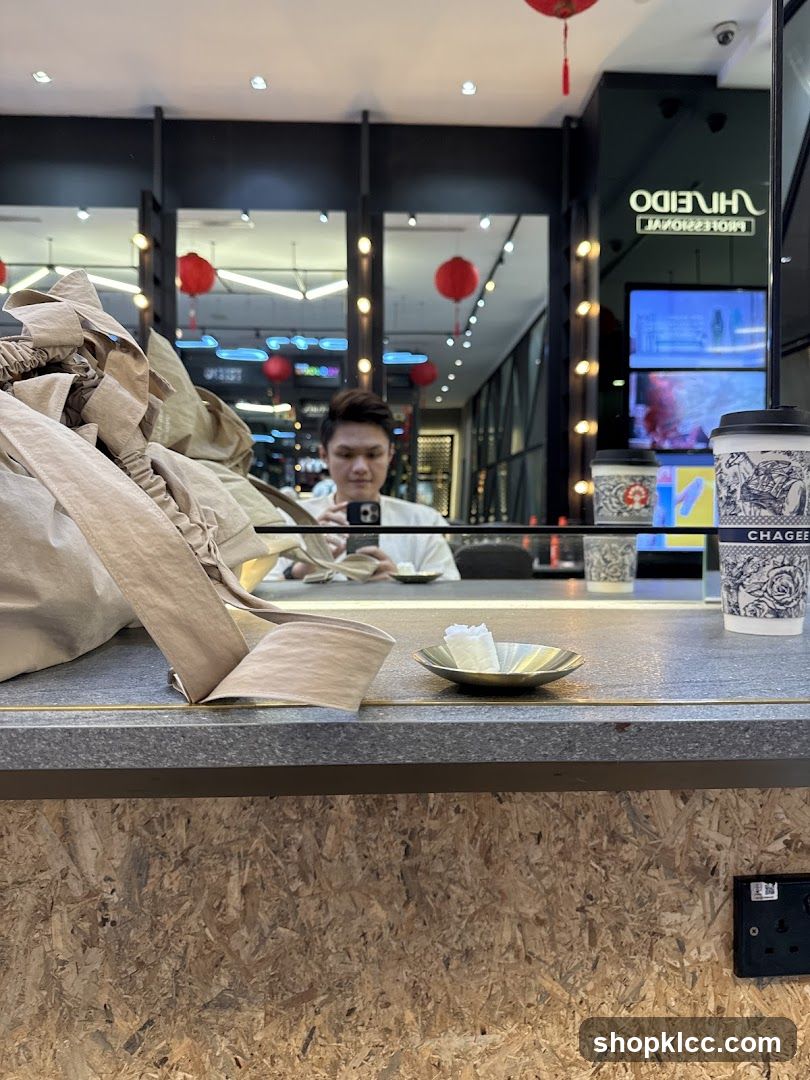 Counter with a person reflected in the mirror