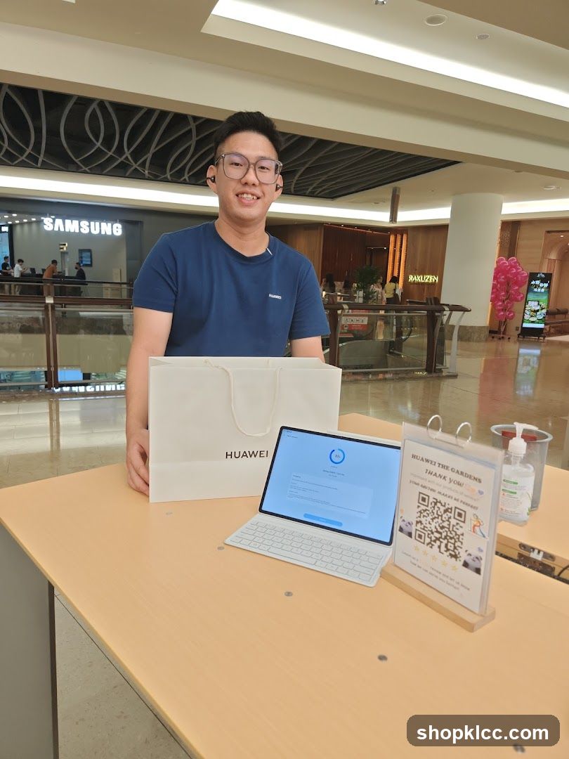 Man with Huawei Tablet and Bag