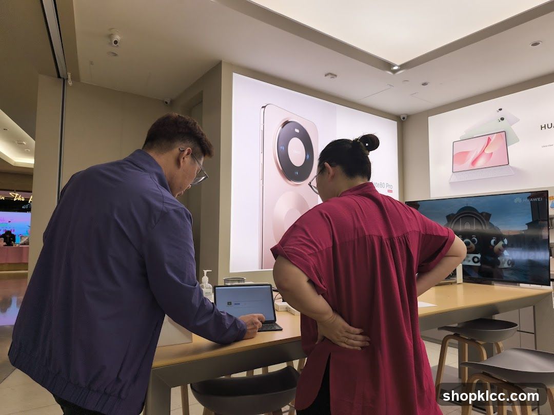 Customers browsing electronics in a store