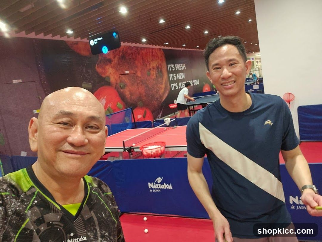 Two men playing table tennis