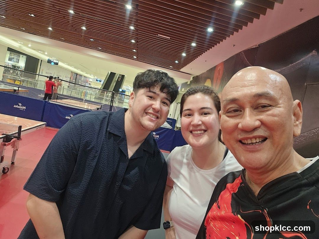 Three people smiling for a selfie