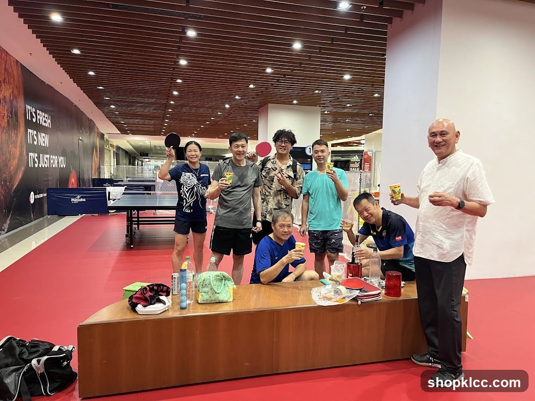 Group of people celebrating at a table tennis venue