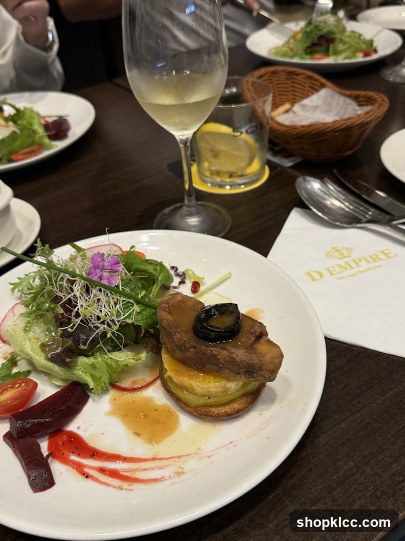 Gourmet Dish with Salad and Wine
