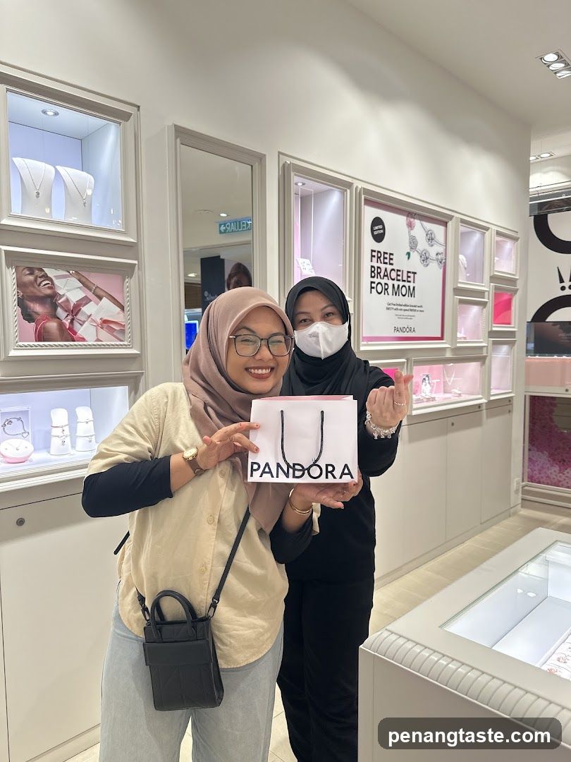Two Women Posing with Pandora Shopping Bag