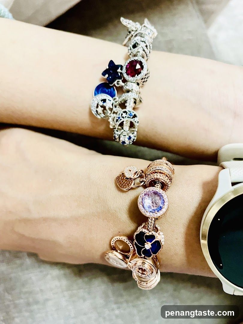 Two Charm Bracelets on Wrists