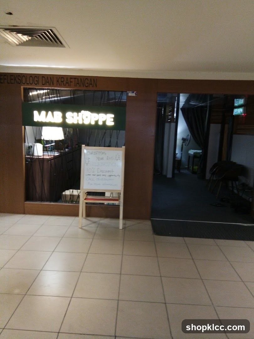 MAB SHOPPE Storefront with Whiteboard Advertisement