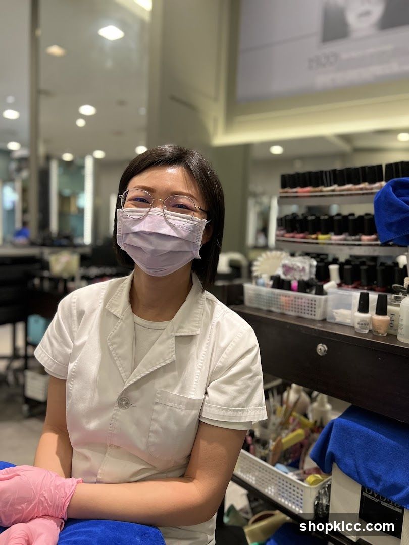 Nail Technician Wearing Mask and Gloves